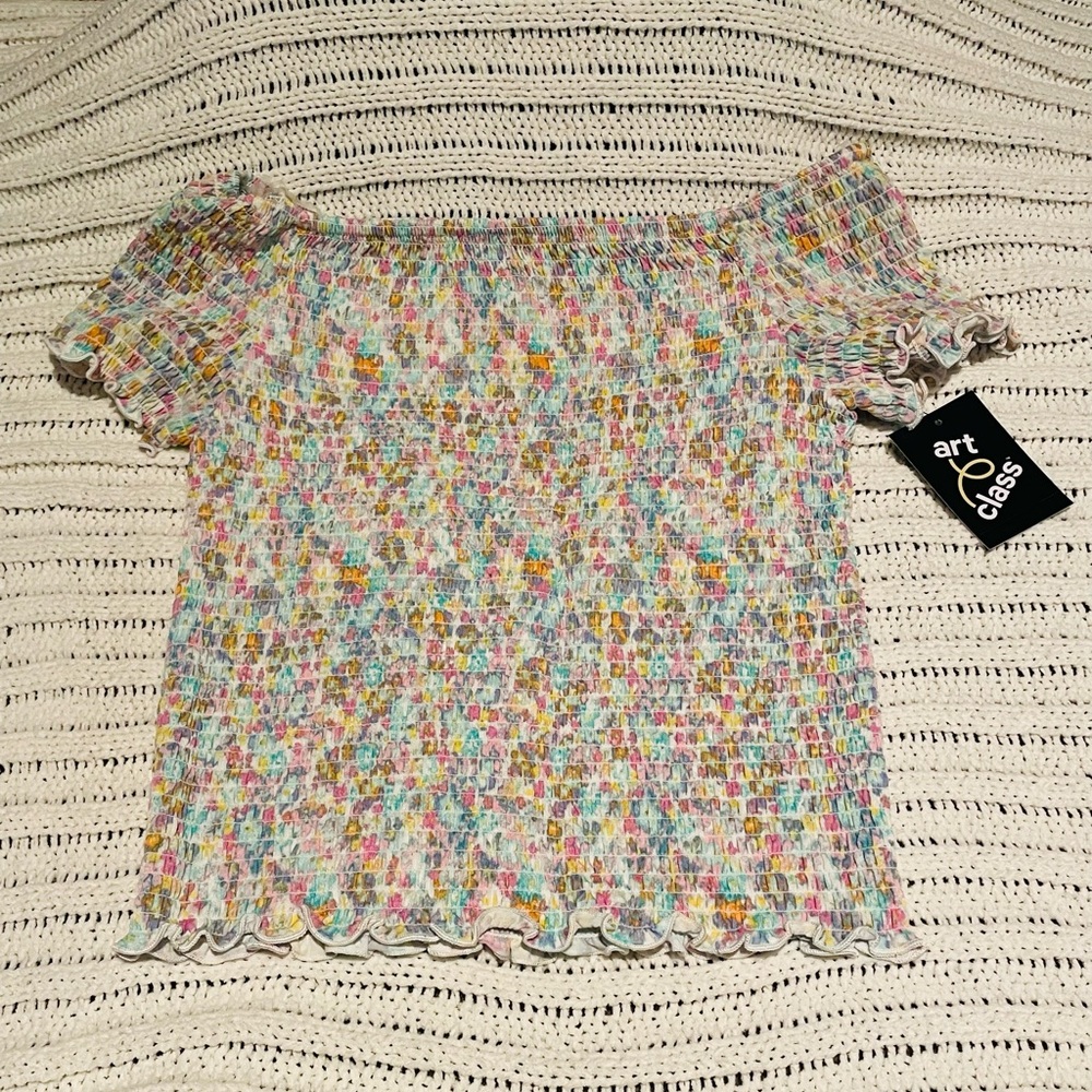 The brand of this shirt is art class, juniors size L. Very stretchy